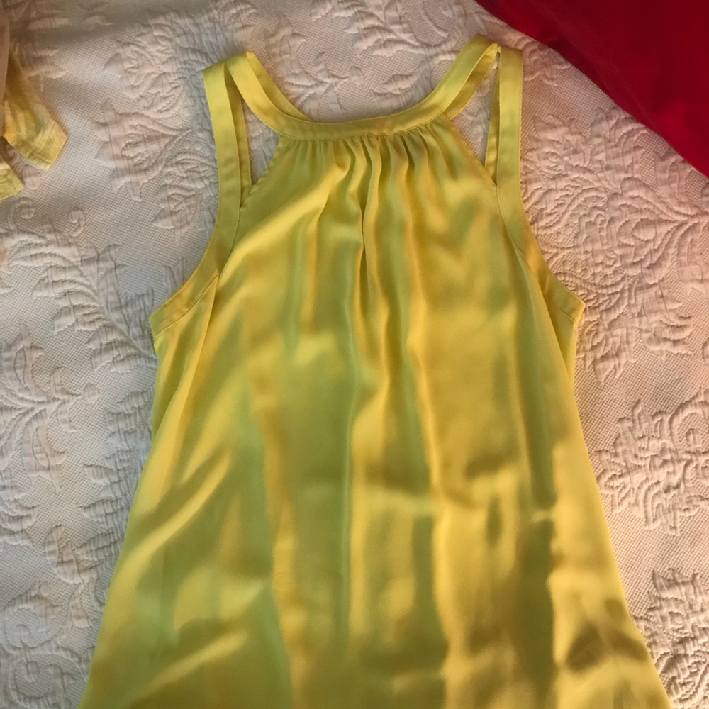 Silky stappy tank with cut out shoulder detail.
